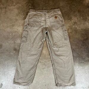 Tan Carhartt double knee pants with a distressed look Size 32x30‎